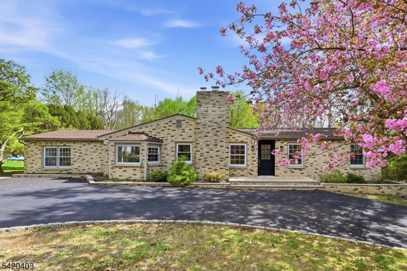 Welcome to one of Chester Township's best values a beautifully renovated 4-bedroom, 2-bath ranch offering the perfect blend of modern updates, timeless charm, and peaceful country living. Set on a picturesque lot backing to preserved Green Acres, this move-in-ready home offers privacy, space, and convenience just minutes from downtown Chester. From the moment you arrive, you'll appreciate the extensive improvements, including a brand-new roof, new blacktop driveway, new masonry front steps, new central air conditioning, 200-amp electrical service, new water softener, and newer water heater. Inside, you'll find a bright, open floor plan with beautiful hardwood floors, oversized windows, and abundant natural light. The spacious living and family rooms, highlighted by a fireplace, provide the perfect space for entertaining. The updated kitchen features granite countertops, stainless steel appliances, abundant cabinetry, and a generous dining area. Step outside to the expansive deck overlooking a private backyard backing to preserved Green Acres. Additional features include an unfinished basement with excellent storage or future expansion potential, natural gas, well water, and septic. Located near award-winning schools, shops, restaurants, parks, golf courses, equestrian facilities, and major commuting routes. Some listing photographs have been virtually staged. Furniture shown are for illustration only and are not included in the sale.