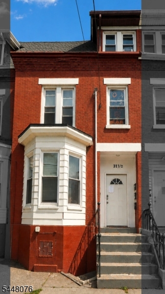 Welcome to this stunning brick brownstone nestled in the heart of Newark, NJ. This fully updated 3-unit multifamily exudes that coveted NYC and Jersey City brownstone charm, sitting on a 17.4x100 lot featuring a full basement and parking. Thoughtfully renovated in 2025 with modern finishes throughout, all three units are currently tenant occupied and generating consistent rental income from day one. Perfect for the seasoned investor seeking immediate cash flow or an owner-occupant looking to live in one unit while collecting rental income from the remaining two units. Experience the charm and character of classic brownstone living at a fraction of NYC and Jersey City prices with low 2025 taxes. Conveniently located with easy access to major highways and NJ Transit for a seamless commute to NYC. Property can be purchased individually or as part of an exclusive package deal with 4 additional side by side brick brownstones on S 12th St totaling 5 properties. Opportunities like this do not last. Schedule your showing today.