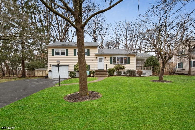 Classic 3-bedroom, 2-bathroom split-level on lush 0.39 acres of mature landscaping. Bright and airy open living/dining room floor plan flows into kitchen for easy entertaining. Screened- in sun room off living room is perfect for warmer days. Spacious kitchen features beautifully crafted hardwood cabinets, premium stainless-steel appliances with gas range and dishwasher, double sink with window overlooking yard. Gleaming hardwood floors throughout rest of home. Three generously sized bedrooms, all with roomy closets. Lower level features bright finished den, laundry room with linen closet, entry to the backyard and garage. Massive fenced-in yard with storage shed. Conveniently located in sought-after Sedgefield. Minutes from major highways, shopping and restaurants!