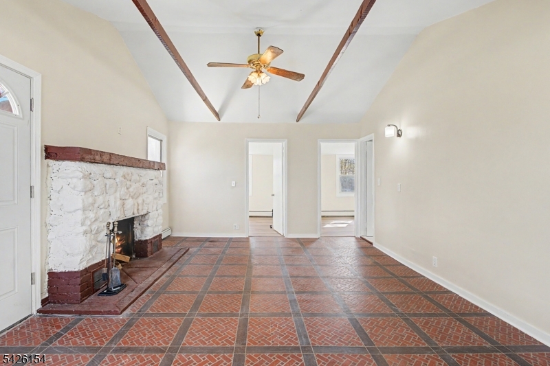 Move-In Ready Cottage with Expansion Potential:  Charming, fully renovated 2-bedroom cottage set on over half an acre in Boonton Township. Features include a brand-new kitchen, updated full bath, and a spacious living room with a stone fireplace and wood-burning stove insert. The property also includes a private yard, large patio, and outbuilding. The oversized lot offers endless possibilities for expansion or building a larger home. Convenient location with access to recreation, shopping, and major highways. Zoned for Mountain Lakes High School.