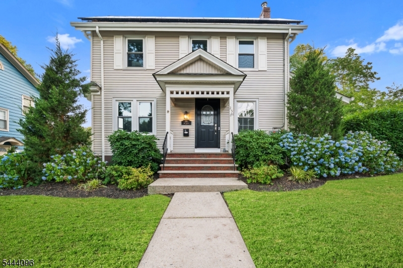 Location! This charming four-bedroom Colonial is ideally situated just steps from highly regarded Spring Garden Elementary School and the neighborhood's beloved deli in Nutley's sought-after Spring Garden section.The spacious eat-in kitchen flows into the family room and overlooks the backyard and patio, creating an ideal setting for everyday living and entertaining. The first floor also features a welcoming living room, dining room and a versatile den that can easily serve as a playroom, home office, or additional living space.Upstairs, the primary suite offers vaulted ceilings, a charming window seat, and a private en-suite bath. Three additional generously sized bedrooms complete the second floor, while the walk-up attic provides outstanding potential for future expansion or abundant storage.Outside, enjoy the spacious backyard and patio, ideal for relaxing or entertaining, along with the convenience of a detached garage.Conveniently located near neighborhood parks, the On3 Campus, Route 3, and transportation into New York City, this home offers the perfect combination of location, comfort, and convenience.