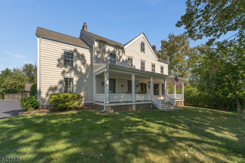 This thoroughly charming Colonial, complete with public utilities, is nestled in the heart of historic Lebanon Borough and is sure to capture your heart. An expansive rocking-chair front porch welcomes you into a home filled with timeless character, featuring wood floors throughout, high ceilings, and abundant natural light. The classic foyer opens to a formal living room with a large bay window and built-in shelving, as well as a bright gathering room with oversized windows. To the left, you'll find a parlor, formal dining room, first-floor office, and spacious kitchen with a large center island, second staircase, and sliders leading to the fenced backyard. A mudroom/laundry room and powder room complete the main level. Upstairs are four generously sized bedrooms, two versatile flex rooms, and two updated full baths, including a primary bedroom with a walk-in closet. A walk-up attic provides excellent storage and future possibilities. Outside, an oversized barn/garage with electric service and a lift to move items from the first to second floor offers exceptional space for work, hobbies, storage, and more. Exterior features include a partially fenced yard, shed, and level backyard with a firepit area. A wonderful place to call home! Furnace less than 10 years old. AC and roof 17 yrs old. Public water, public sewer and natural gas. *Interior photos to follow*