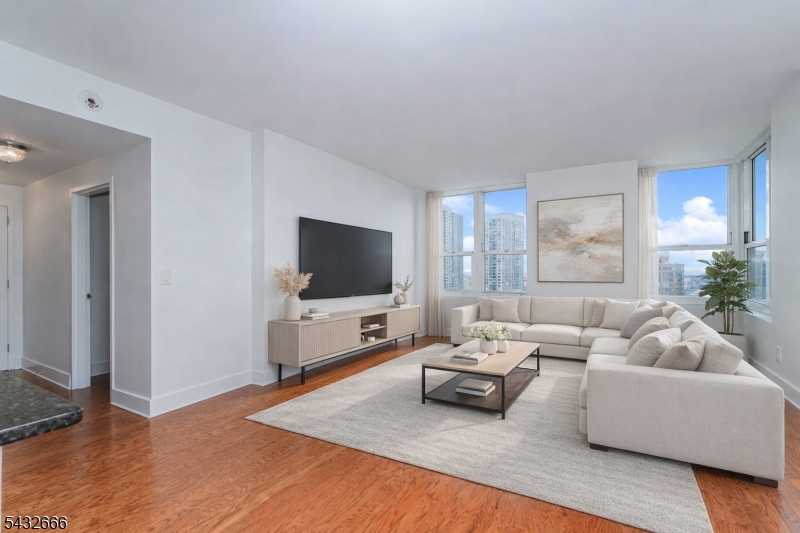 Perched on the 37th floor of one of Jersey City's premier waterfront residences, this stunning 843 sqft corner unit condominium at 88 Morgan Street offers breathtaking unobstructed views of the city and beyond! Flooded with natural light through expansive floor-to-ceiling windows, this beautifully appointed residence features a spacious and thoughtfully designed layout ideal for everyday living. The modern kitchen is equipped with sleek cabinetry, granite countertops, and high-end stainless steel appliances, seamlessly flowing into the open-concept living and dining area. The bathroom offers a double-vanity, and the spacious bedroom is boasted with oversized windows that offer more unobstructed views. Residents of 88 Morgan enjoy resort-style amenities, including a 24-hour concierge, state-of-the-art fitness center, outdoor pool, full spa, children's playroom, and many more. Perfectly situated in the heart of the Powerhouse Arts District, you're just moments from the PATH train, ferry, waterfront promenade, and an array of top dining, shopping, and nightlife options. Experience elevated urban living with luxury, convenience, and iconic views all in one. *Pictures include virtual staging*