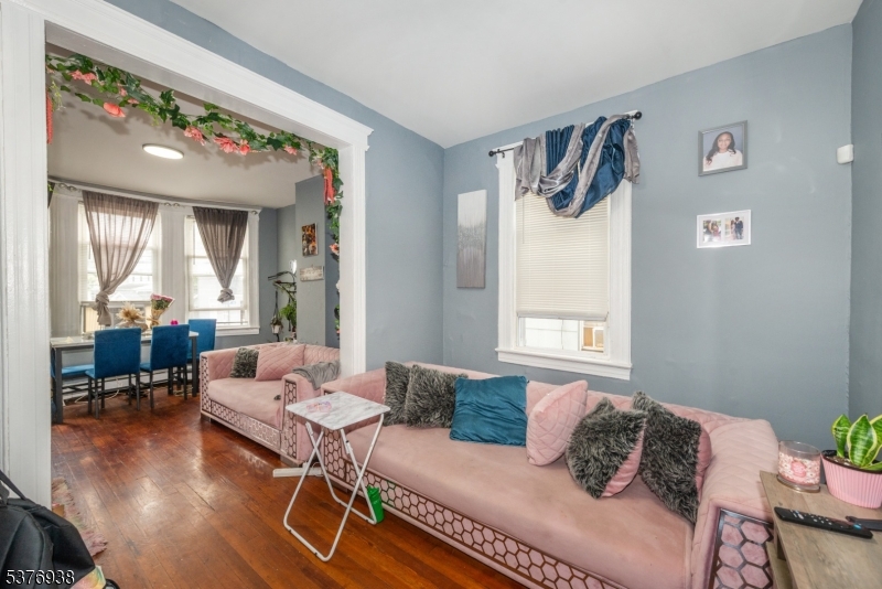 Welcome to this refreshed fourplex in the heart of West Orange, an ideal opportunity for both investors and owner occupants! This side-by-side layout offers four total units: three 2-bedroom units and one 3-bedroom unit, each with functional layouts, great natural light, separate utilities, and some recent updates. Making it move-in/rent-ready with upside to increase value and income. Potential rental income of $10,000/month! Transit-friendly location with a NYC bound bus stop right outside your door, and just minutes from the Morris & Essex line, offering Midtown Direct train service to NYC. West Orange also offers free jitney service to nearby train stations. Conveniently located near shopping, dining, schools, and major highways, this property is a true gem! ONE UNIT WILL BE DELIVERED VACANT.
