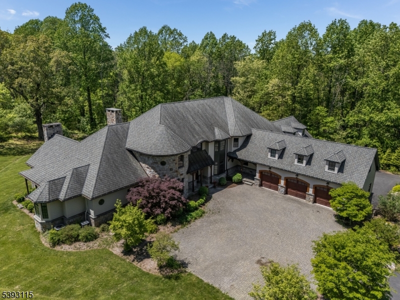 A SPECTACULAR TOTALLY PRIVATE 9,931 SQ FT CUSTOM COLONIAL ESTATE FEATURING 8  BR & 8 FULL BATHS, SITUATED ON 56+ FARM-ASSESSED ACRES. THIS STUNNING PROPERTY OFFERS THE ULTIMATE BLEND OF LUXURY, COMFORT, & COUNTRY ELEGANCE. THE GRAND 2 STORY FOYER WELCOMES YOU W/ TRAVERTINE FLOORS & OPENS TO AN ENORMOUS GREAT ROOM FEATURING A FULL WALL OF FLOOR-TO-CEILING WINDOWS OVERLOOKING A PRIVATE BLUESTONE PATIO. THE GOURMET CHEF'S KITCHEN W/ GRANITE COUNTERTOPS, WALK-IN BUTLER'S PANTRY, WET BAR, & ESPRESSO BAR. ENJOY TOP-OF-THE-LINE STAINLESS STEEL APPLIANCES INCLUDING A 60" WOLF RANGE, 2 DOUBLE OVENS, WINE COOLER, 2 DISHWASHERS, & A DRAMATIC 2 STORY CIRCULAR BREAKFAST AREA. THE FIRST-FLOOR PRIMARY SUITE OFFERS PRIVATE ACCESS TO A GYM W/STEAM SHOWER & SAUNA, ALONG WITH A LUXURIOUS SPA-LIKE MASTER BATH. ADDITIONAL BEDROOMS INCLUDE AN ENSUITE GUEST ROOM, JACK-N-JILL BEDROOMS WITH CONNECTING BATH, AND A SEPARATE ENTRY AU PAIR SUITE IDEAL FOR GUESTS. THE PROPERTY FEATURES ATTACHED GARAGE PARKING FOR 8 CARS PLUS AN IMPRESSIVE 8-STALL BARN COMPLETE WITH A 2 BR, 2 BATH CARETAKER'S APARTMENT. THE BARN INCLUDES MAHOGANY STALLS, WORKSHOP, TACK ROOM, WASH STALL, & HAYLOFT. AMENITIES INCLUDE A FULL-HOUSE GENERATOR, RADIANT HEAT, MULTI-FUEL HEATING SYSTEM, & ENDLESS OPEN FIELDS  FOR HORSEBACK RIDING OR FARMING. ENJOY A PRIME LOCATION JUST MINUTES FROM ROUTE 78. THIS IS A RARE OPPORTUNITY TO OWN A TRUE COUNTRY ESTATE THAT OFFERS EXCEPTIONAL PRIVACY, ELEGANCE, FUNCTIONAL LUXURY &  TRULY  UNIQUE.