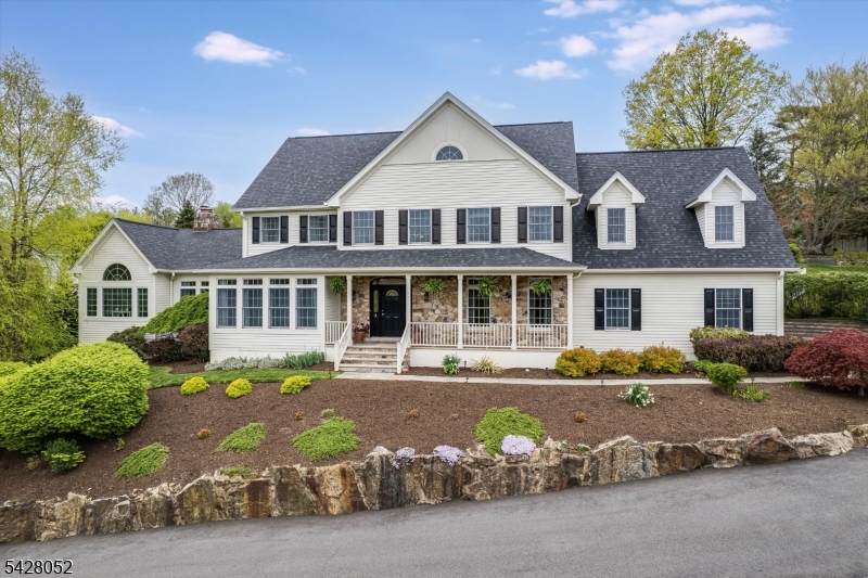 Totally renovated 5 bdrm, 4.5 bath colonial in sought-after Morris Twp. Blending timeless architecture w sophisticated modern updates, this exceptional home offers both elegance & functionality for today's lifestyle. Beautiful finishes & thoughtfully designed living spaces are evident throughout. The custom designed kitchen is the heart of the home & boasts white wood inset cabinetry, leathered granite countertops, 48" Wolf range, porcelain farmhouse sink &10 ft. center island w seating. Open to the kitchen, the family room offers 12 ft. ceiling, walls of windows, 2 story stone fireplace, & French doors leading to the light-filled sunroom. Flanking the foyer are living & dining rooms w oversized transom windows and a butler pantry connecting to the kitchen. Also included on the 1st floor is an ensuite bedroom w beautiful bath & large laundry room w access to the oversized 3 car garage. Upstairs the primary suite enjoys a tray ceiling w polished nickel chandelier, spectacular custom closet & spa-like marble bath w free standing tub, built-in shelving & walk-in shower. 3 additional bdrms & a beautifully designed bath continue the home's refined aesthetic. The finished lower level offers a kitchenette, full bath, & plenty of addit'l living & recreation space. Step outside to a large trex deck, terraced rear yard & beautiful rose garden. Convenient to everything Morris Twp has to offer, incl close proximity to NYC direct train,commuting highways & vibrant downtown Morristown.