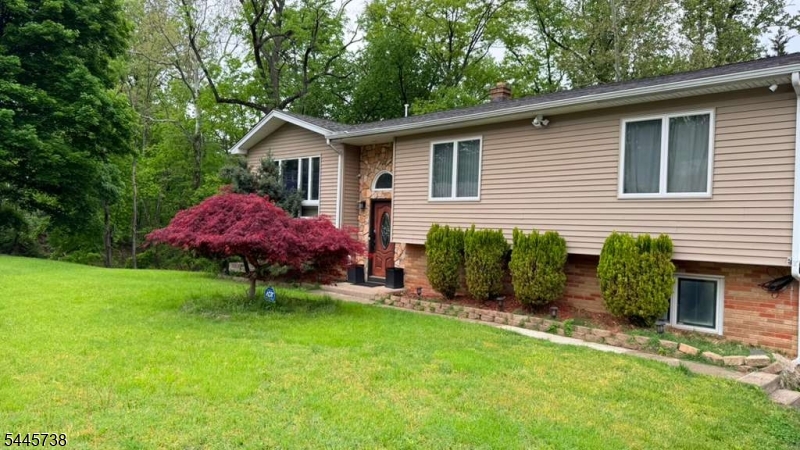 A totally updated home in a quiet section of Woodland Park. Features 3 bedrooms, Sunroom, two full bathrooms, a half bathroom, two car garage, a large driveway. Overlooking deck. Enjoy the above ground pool and magnificent view. This house is close to schools, shopping centers and Highways.