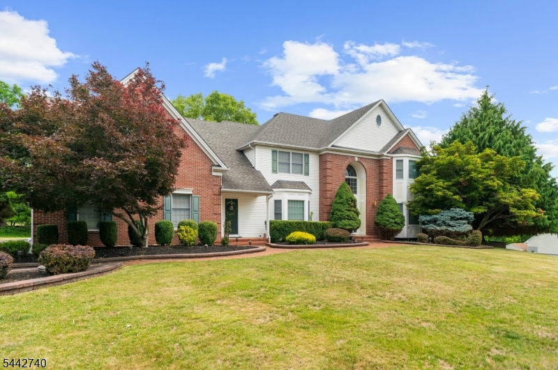 Desirable Colonial in Rolling Hills Estates! This exceptional 4-bedroom, 5.1-bath home offers an ideal blend of elegance, comfort, and functionality. A dramatic two-story foyer welcomes you into a thoughtfully designed floor plan featuring a formal dining room with tray ceiling, a sun-filled conservatory with bar area, and a spectacular two-story family room showcasing skylights and a floor-to-ceiling stone fireplace. The gourmet kitchen is equipped with a center island, granite countertops, built-in refrigerator, and abundant cabinetry, making it perfect for everyday living and entertaining. A first-floor bedroom or private office with an adjoining full bath provides flexible living options for guests. Upstairs, the luxurious primary suite features a tray ceiling, spa-inspired bath with soaking tub, walk-in shower, dual vanities, and generous closet space. Additional bedrooms are served by both a Jack-and-Jill bath and a private hall bath. The finished walk-out lower level adds approximately 1,800 square feet of living space and includes a kitchenette, wet bar, recreation area, gym, office, and full bath ideal for entertaining, working from home, or extended stays. Nestled in a peaceful setting, the backyard is highlighted by a charming gazebo, creating the perfect place to relax and enjoy the surrounding landscape. This impressive home offers space, style, and exceptional amenities in one of the area's most desirable neighborhoods.