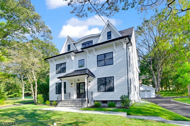 Welcome home to a masterpiece of refined living. This completely renovated & expanded 5-bed, 5-bath home offers approx. 4,800 sq. ft. of luxury across 4 finished levels, perfectly set on a 0.47-acre lot in one of NJ's most sought-after school districts. At the heart of the home, is the gourmet chef's kitchen, featuring high-end Viking appliances, a 48" Gas range, a dramatic 100" quartz island, walk-in pantry, & cozy breakfast nook. The open-concept layout flows seamlessly into the family room, highlighted by custom built-ins, a fireplace, & expansive 12' sliding doors that open to a covered patio ideal for effortless indoor-outdoor entertaining. The 1st floor also boasts a private office/guest room, a full bath, a mudroom with heated floors, & a formal dining room complete with a custom wet bar. Upstairs, the primary suite is a true retreat, showcasing a custom WIC with built-in safe, a spa-inspired bathroom with 24x48 marble tile, skylights, & an 84" double vanity, a bonus room off the master offers additional private space; this levels also feature 3 additional bedrooms, full bath, and a laundry room for added convenience. Top level includes a guest bedroom, a full bath & loft. The fully finished basement features a large rec room with dry bar, custom built-ins, fireplace, and a full bathroom perfect for entertaining or relaxing. A breezeway conveniently connects the oversized two-car garage to the home. Don't miss this Luxury Home !!!