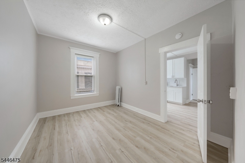 Charming, freshly renovated 1 bedroom, 1 bathroom apartment available in Passaic. This unit features updated finishes throughout and an efficient layout ready for immediate occupancy. Comfort is provided via baseboard heat and a window air conditioning unit, with public gas and sewer service. Rent includes water and sewer, with tenant responsible for remaining utilities. Additional conveniences include laundry available in the basement. Pets are welcome with a $199 pet fee. Available for a 12-month lease with one month's security deposit required. Don't miss this move-in ready rental in a convenient Passaic location   schedule your showing today!