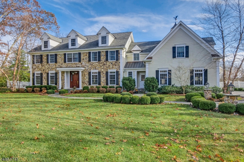 Perfectly Poised on one of New Vernon's Most Sought After Roads This Stunning Fieldstone 2010 Colonial was Customized to Perfection by the Current Owners. Tranquility and Convenience! A Gracious 2 Story Foyer Sets the Stage for Elegantly Appointed Formal Entertaining Spaces also include Sun Room , Mahogany Library,  and Gallery that lead to the Gourmet Kitchen and Family Room w/Custom Built ins and a Wood Burning Fireplace.Two sets of French Doors Access the Covered Terrace and Bluestone Patio with Built in Outdoor Kitchen for Entertaining with Sweeping Sunlit Views of the Rear Property and Protected lands A Luxurious Master Suite Complete With Office, Fireplace, Double Walk in Closets and Master BathProvide an Elegant Retreat. Four Generous Bedrooms and 3 Baths Complete the Second Floor.