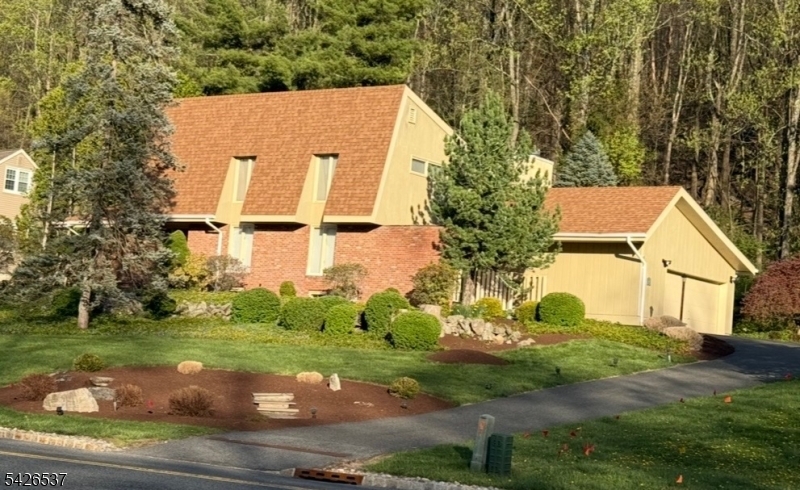 Beautiful custom home in the amenity filled gated community of Panther Valley with timeless style and quality throughout. Hardwood floors, custom built ins and custom moldings add to the charm of this home. The main level has formal living and dining spaces, a large kitchen open to the den and butler's pantry/wet bar, perfect for entertaining as well as a beautiful screened porch. First floor primary ensuite with two walk in closets and a California jetted tub, a powder room and laundry space round out the first floor. Upstairs are three spacious bedrooms and a full bath and there is a perfect rec area as well as lots of storage in the finished basement. A well landscaped yard with mature plantings make this home a must see. Enjoy the multiple tennis courts, pools, walking paths and beautiful views of Panther Valley as well as close proximity to local restaurants and shopping and Route 80 for an easy commute. Come see this beautiful home today!