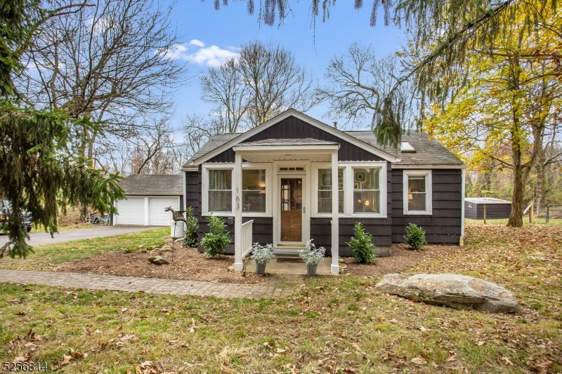 Country charm abounds in this adorable Cottage on 5 Private Acres   Minutes to Rt 31 yet so private and quiet. 2 beds 1 full bath, gleaming hardwood floors and an oversized 2 car detached garage make this a home you must see.  Owners have made the following upgrades:  200 amp service panel installed and Electric Vehicle Charger Added 2023, Septic replaced/repaired in 2021, old well decommissioned in 2021 by the previous owners, new sump pump in 2022, Propane tank(leased) added for gas cooking stove, new chimney liner added 2022.  Well cared for by current owners. All exterior buildings and home have been freshly painted. Move in to enjoy the one floor living, skylights, peace and quiet, open floor plan, privacy, lots of windows for natural light, mature trees, and yet access to major highways and shopping/dining.  This home has the best of both worlds.  Come and make this your new home!