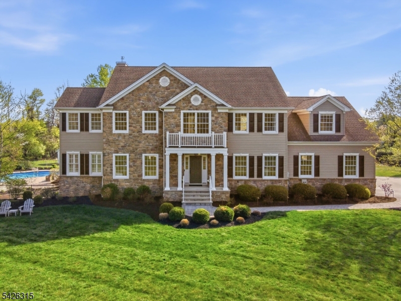 Tucked away at the end of a quiet cul-de-sac, this exceptional custom home built in 2013 is set on 11.13 breathtaking acres offering the perfect blend of luxury, privacy, and versatility. Whether you dream of peaceful country living, creating a hobby farm, or accommodating horses and farm animals, this remarkable property offers endless possibilities in a picturesque setting.  Every room showcases outstanding craftsmanship with extensive custom wood trim work, elegant finishes, and beautiful natural light throughout. The thoughtfully designed floor plan features a stunning gourmet kitchen complete with a large center island, stainless steel appliances, butler's pantry, and abundant cabinetry, perfect for entertaining and everyday living. A private first-floor office provides ideal work-from-home flexibility.  The luxurious primary suite is a true retreat featuring a spa-like bathroom with a jacuzzi tub, oversized stall shower, sitting room, and impressive walk-in closet. Additional bedrooms are generously sized with beautifully appointed bathrooms. The walkout lower level offers additional living and entertaining potential, while a whole-house backup generator adds convenience and peace of mind.  Step outside to your own private paradise featuring a sparkling swimming pool, hot tub, expansive Trex deck with covered seating areas, elaborate gardens, and open lawn space perfect for recreation, entertaining, or simply enjoying the tranquil surroundings.