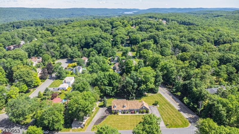 Nestled in the highly desirable Olde Milford Estates neighborhood,this impeccably maintained CUSTOM Colonial/Cape Cod offers the perfect blend of timeless charm,quality craftsmanship&convenience.Set on a beautifully landscaped corner property,this spacious home features 5 bedrms, 3 full baths,&1/2 bath,providing ample rm for both everyday living&entertaining.This custom built home has remained in the same family since it was constructed!The lemonade porch sets the tone for this exceptional home,offering the perfect place to unwind&enjoy.Floor plan boasts formal living rm filled w/natural light,an formal dining rm!A warm,inviting family rm,&a spacious kitchen designed for everyday living&entertaining,center island,sep.walk-in chef's pantry for storage&organization&charming breakfast nook.Generous rm sizes throughout.The spacious deck overlooks a beautifully maintained backyard with plenty of open space,the yard provides endless opportunities fun,gardening,&entertaining.Highlights incl.2 sep.heated 2-car garages,space for up to 8 vehicles, hobbies,or workshop areas.The heated basement offers exceptional storage&endless possibilities.The walk-in attic provides valuable storage space&expansion potential.City water&sewer,natural gas add to the home's efficiency.Pride of ownership!Located just min. from major highways,shopping,dining,&everyday amenities.This home combines the tranquility of a premier neighborhood w/easy access to everything you need. A RARE FIND!