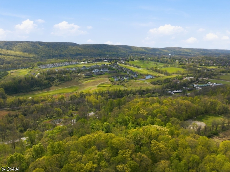 ACROSS FROM CRYSTAL SPRINGS GOLF RESORT & MINUTES TO GREAT GORGE SKI AREA ATTENTION BUILDERS/DEVELOPERS! Opportunity knocks with this impressive 28.80-acre parcel spanning Hardyston and Vernon Townships along the Vernon/Hamburg border. Comprised of three contiguous lots (Lot 15 Block 15, Lot 1.03 Block 15 in Hardyston, and Lot 8 Block 587 in Vernon), this expansive property creates a rare, contiguous tract with multiple road frontages and paved access points. Set in a residential/commercial area and beginning in the picturesque Pleasant Valley Lake community, the land backs to Route 94 and offers both accessibility and a beautiful sense of space and privacy. Forestry assessed and not located in the Highlands, this unique parcel presents exceptional potential for future plans or investment in a highly desirable Sussex County location. Enjoy close proximity to Vernon and Hamburg, with convenient access to shopping, dining, recreation, and year-round attractions.