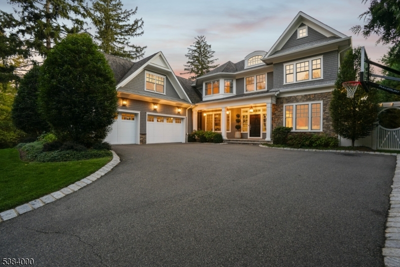Custom, Chic & Perfect! Welcome to 49 Woodcrest Avenue, a bespoke 6BR, 6.2BA Colonial ideally located on a private road in Short Hills, close to downtown and the NYC train. Elegant yet comfortable, perfect for everyday living, indoors or out. Step into the breathtaking foyer with soaring 10' ceilings and feel the spaciousness throughout. Relax in the inviting living room or host guests in the formal dining room. The open-concept kitchen and family room are flooded with natural light from oversized glass doors. The chef's kitchen features 3 Wolf ovens, a Wolf range, Sub-Zero fridge, refrigerated drawers, 2 Bosch dishwashers, microwave drawer and water filtration. Entertain effortlessly with Sonos throughout the first floor, patio, and pavilion. Enjoy a custom bar, built-ins, formal/informal powder rooms, large pantry, and mudroom. French doors lead to a backyard oasis with heated saltwater pool (auto cover rated for an elephant!), pavilion with grill, TV, fridge, fireplace, fenced yard, and oversized car garage. A tucked-away guest suite offers peaceful backyard views. Upstairs, the luxurious primary suite includes a spa-like bath, 2 California closets, one with a glass-topped island (Carrie Bradshaw would be jealous) and a private office. All bedrooms are en-suite with custom baths. The finished basement offers a bunk room, gym, rec space, full bath. (Room for wine cellar/wellness area.) Thoughtfully designed to offer luxury, comfort, and effortless sophistication!