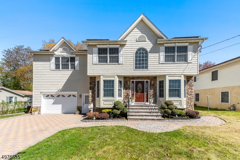 GORGEOUS, NEWER HOME IN DESIRABLE LK PARSIPPANY.  4 BR, 2.5 BATHS AND FULL FINISHED BASEMENT.  BRIGHT & AIRY, 2 STORY FOYER WELCOMES YOU TO OPEN FLOOR PLAN WITH WOOD FLOORING AND CROWN MOLDING. KITCHEN BOASTS GRANITE CNTRTOPS,  BACKSPLASH, NEWER APPLIANCES, 2 PANTRIES & SLIDERS THAT OPEN TO LARGE DECK.  OVERSIZED ONE CAR GARAGE HAS ATTACHED 21 X 13 WORKROOM OR ADDITIONAL OFFICE SPACE.  ABUNDANT CLOSET SPACE IN THIS HOME! HUGE MASTER BR SUITE, LAUNDRY ROOM AND 3 ADDITIONAL BR AND BATH COMPLETE THE 2ND FLOOR. HI EFFICIENCY FURNACE, UPGRADED INSULATION THROUGHOUT & MULTI ROOMS IN FINISHED BASEMENT COMPLETE WITH POOL TABLE & HOME GENERATOR COMPLETE THIS GEM. ALL WITH PUBLIC UTILITIES AND A 1 YEAR HOME WARRANTY! MINUTES TO PARK/RIDE BUS TRANSPORTATION, SCHOOLS AND PARKS.