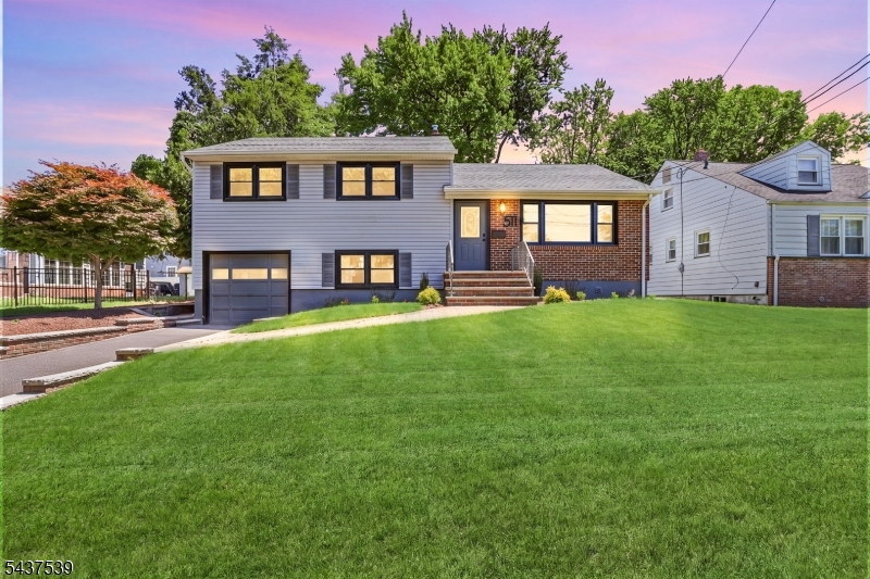 Welcome to 511 Locust Ave, a beautifully renovated split-level residence offering refined style, upscale finishes, and exceptional outdoor space in sought-after Garwood. This elegant home features three spacious bedrooms and one beautifully updated bathroom, complemented by a bright and inviting layout designed for both everyday comfort and entertaining. At the heart of the home is a stunning designer kitchen showcasing high-end finishes, sleek cabinetry, premium stainless steel appliances, and sophisticated details that create a truly elevated feel. The spacious living and dining areas flow seamlessly, while the lower-level family room provides an additional versatile space perfect for relaxation, gatherings, or a home office. Upstairs, you'll find three generously sized bedrooms and a beautifully appointed bathroom. Step outside to a huge oversized backyard offering endless possibilities for entertaining, outdoor dining, gardening, or creating your own private retreat. Additional highlights include an attached one-car garage, private driveway, and a semi finished basement with excellent storage potential. Combining modern luxury, thoughtful updates, and impressive outdoor space, this move-in-ready home is a rare opportunity you won't want to miss. Grab it before it's gone!