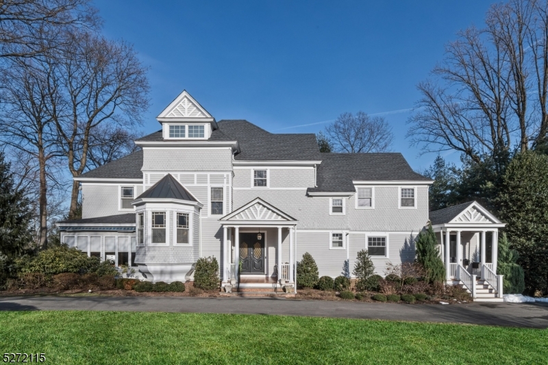 This iconic 1875 Victorian Colonial manor is a true piece of Ridgewood history and has been masterfully updated for today?s modern lifestyle. Located in the heart of the Village just steps to downtown shops, restaurants, and commuter transportation. Brimming with architectural details, features include a grand entry foyer with spectacular woodwork, handmade mahogany doors, 10-foot ceilings, and five unique tile inlay fireplaces. The centerpiece of the home is the newly renovated and expanded gourmet kitchen, with a large seated island, professional grade appliances, and custom bar area. A gorgeous primary suite features a private balcony, large sitting room, two fireplaces, remodeled bath, and large walk-in closet. 10 foot wide glass doors off the kitchen open to a handsome raised deck that runs the length of the home overlooking more than half acre of private property, offering year-round entertainment options. Don?t miss this landmark home! Owner holds NJ real estate license.