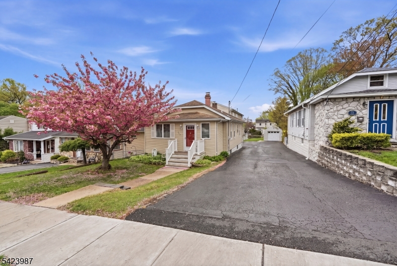 This exceptional and extraordinary single-family home features a significant and remarkable extended addition. Deceptive from a drive-by, this home is what many have been waiting for! The extension is the ideal in law suite setup. The front part of the house includes a front mud room, a living room with a wood-burning fireplace, a dining room, two bedrooms, a front den, and a  rear den, and a full bath. The basement is finished with a full bath and a summer kitchen. Enter the extension from the side door, it boasts a large first-floor flow with a living room, dining room, a lovely eat-in kitchen with a slider to the deck, and a very deep yard. The exquisite second floor is a stunner, boasting its depth and three awesome skylights. There are three bedrooms; the master has a full stall shower, a walk-in closet, and laminate flooring. The two additional bedrooms each have double closets and berber carpeting in BR's.  The basement in the addition is a large space, there is a family room plus a large storage room. Driveway shares the apron, and widens in rear. Please do not park on neighbors side of driveway.