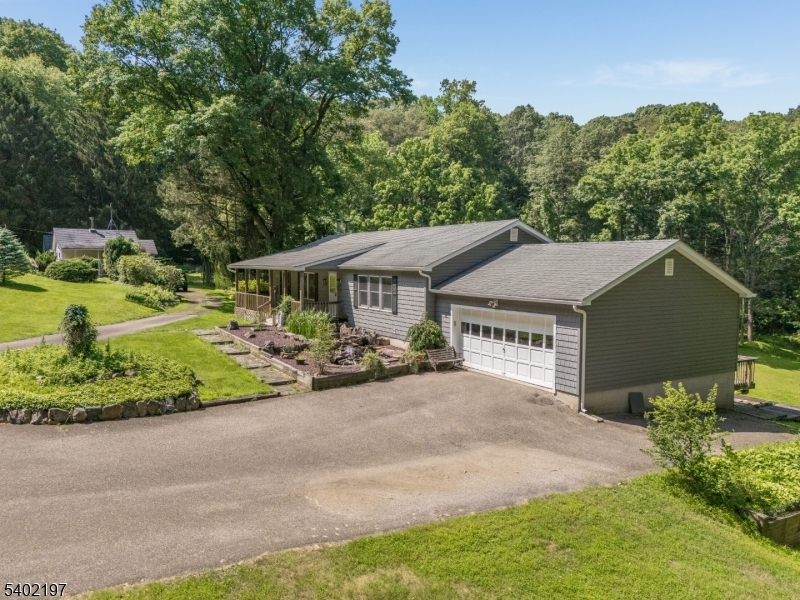 WELCOME TO 22 POLKTOWN ROAD   A RARE AND EXCITING OPPORTUNITY FEATURING THREE SEPARATE RANCH-STYLE HOMES ON ONE LOT!  SET ON 6+ BEAUTIFUL ACRES IN THE HIGHLY DESIRABLE SPRUCE RUN SECTION OF HUNTERDON COUNTY, THIS UNIQUE PROPERTY OFFERS EXCEPTIONAL VERSATILITY AND INCOME POTENTIAL. THE PROPERTY INCLUDES TWO INCOME-GENERATING HOMES IN ADDITION TO THE OWNER-OCCUPIED MAIN RESIDENCE. 20 POLKTOWN ROAD FEATURES 2 BEDROOMS AND 1 FULL BATH, WHILE 24 POLKTOWN ROAD OFFERS 1 BEDROOM AND 1 FULL BATH   BOTH CURRENTLY RENTED TO LONG-TERM TENANTS.THE MAIN HOME AT 22 POLKTOWN ROAD BOASTS 3 BEDROOMS AND 2 FULL BATHS, A BRIGHT EAT-IN KITCHEN, FORMAL DINING ROOM, AND A SPACIOUS LIVING ROOM WITH A COZY WOOD-BURNING FIREPLACE. ENJOY SEAMLESS INDOOR-OUTDOOR LIVING WITH AN OVERSIZED DECK, PERFECT FOR ENTERTAINING OR RELAXING WHILE TAKING IN THE TRANQUIL NATURAL SURROUNDINGS.THE LOWER LEVEL OFFERS A RECREATION ROOM, LAUNDRY ROOM, UTILITY ROOM, WORKSHOP, AND ABUNDANT STORAGE SPACE.THIS IS A FANTASTIC OPPORTUNITY TO OWN A MINI REAL ESTATE PORTFOLIO   LIVE IN ONE AND RENT THE OTHERS OR INVEST IN ALL THREE! ALL LOCATED IN A TOP-RATED SCHOOL DISTRICT WITH EASY COMMUTING ACCESS AND CLOSE PROXIMITY TO FARMS, RESTAURANTS, PARKS, AND EVERYTHING THE HUNTERDON COUNTY LIFESTYLE HAS TO OFFER.
