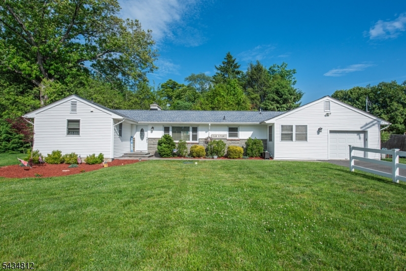 Welcome home to this beautifully updated ranch style home offering 3 bedrooms and 1.5 baths, thoughtfully designed for comfortable everyday living and effortless entertaining. Step inside to an inviting kitchen featuring granite countertops, stainless steel appliances, and a sun filled breakfast area. The open concept layout showcases a bright and airy living room with a cozy wood burning fireplace that flows seamlessly into the dining area, creating the perfect gathering space. Gleaming hardwood floors run throughout the home, adding warmth and charm. The home offers 3 generously sized bedrooms along with 2 beautifully renovated baths featuring custom tile work. A convenient main level laundry room and powder room enhance everyday functionality. The fully finished basement provides valuable additional living space, ideal for a family room, recreation area, home office, or gym. Set on a perfectly level lot, the backyard is designed for both relaxation and entertaining, featuring a newly installed patio along with a spacious grassy area. Conveniently located near Lake Mohawk, the town center, schools, shopping, and NJ/NY transportation. Recent upgrades include a new roof and septic system, offering added peace of mind.