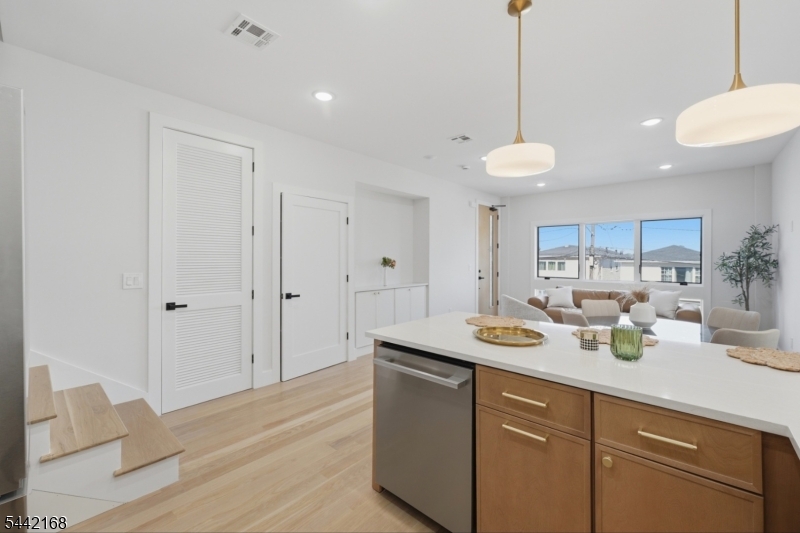 Welcome to 98 Western Avenue Unit 1, a beautifully designed 3-bedroom 2.5-bathroom luxury condominium located in the highly sought-after Western Slope section of Jersey City Heights.offering the perfect blend of modern elegance, spacious living, and commuter convenience, this exceptional home is designed for today?s lifestyle. Step inside to discover an expansive open-concept layout featuring a large family room, stunning designer finishes, oversized windows, and abundant natural light throughout.The gourmet kitchen seamlessly flows into the living and dining areas, creating the ideal space for entertaining and everyday living.The spacious primary suite serves as a private retreat, complete with a generous walk-in closet and a luxurious en-suite bathroom.Two additional well-sized bedrooms provide flexibility for guests, or a home office. Additional highlights include an in-unit washer and dryer, central air conditioning, garage parking access, and a private backyard patio perfect for outdoor dining, relaxation, and entertaining. Ideally positioned in JerseyCityHeights? desirable Western Slope neighborhood, residents enjoy easy access to NewYorkCity via nearby transportation options, while remaining just minutes from major highways including Routes 1&9, I-78, the NJ Turnpike, and the Holland Tunnel. Enjoy close proximity to local parks, vibrant restaurants, cafes, shopping, and all the conveniences that make Jersey City one of the region?s most dynamic places to live.