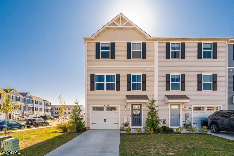 This stunning end-unit townhouse, built in 2023, offers modern design and thoughtful layout across three levels. Inviting foyer welcomes you to the ground floor of this gorgeous unit featuring a versatile office space, ample storage, and convenient access to the built-in garage.  The main floor boasts an open floor plan, including a beautifully designed kitchen with a center island, quartz countertops, and stainless-steel appliances. Adjacent to the kitchen is a dining area with access to a spacious deck overlooking the private, fenced-in yard " one of the few units with this feature. A powder room completes this level. The second floor includes three bedrooms and two full bathrooms, including the master suite with a walk-in closet and en-suite bath. Laundry is conveniently located on this floor. The home is equipped with energy-efficient windows, LPV flooring (scratch and stain resistant), and a tankless water heater. Low maintenance fee and a transferable builder warranty (2 years on mechanical, 10 years structural) make this home an excellent choice. Don't miss out on this unique opportunity for modern living with low upkeep!