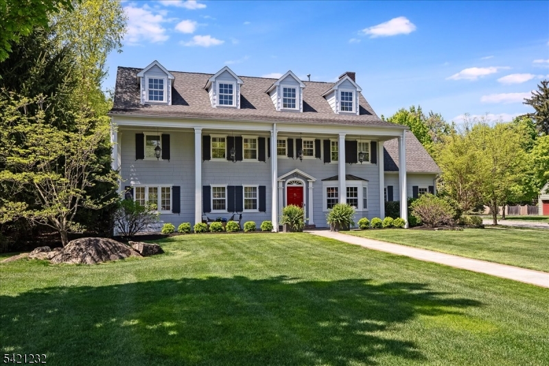 Welcome to 430 Ridgewood Ave, a stately Southern Colonial where classic architecture meets sophisticated, luxurious renovations. The beautifully re-designed eat-in kitchen-bespoke in every detail- features a Sub-Zero refrigerator, 48" Wolf range, honed granite countertops, oversized island & built-in banquette, flowing into an adjacent family room. A large formal dining room, over-sized living room w/ coffered ceiling & fireplace, sunroom w/ wet bar & mud room w/ full bath complete the refined 1st floor. Upstairs, a spacious primary suite w/ dressing room & spa-like en-suite bath finished in high-end materials, plus 2 additional bedrooms & hall bath. The 3rd fl offers 2 large bedrooms, one w/ attached office, full bath & storage. A finished basement adds a rec room, game room, full bath & laundry. Outside, a show stopping bluestone patio w/ built-in gas fireplace, grill, outdoor TV & bar seating is surrounded by a large, level, fenced yard w/ mature landscaping for privacy & room to play. Oversized attached garage w/ EV charger, new multi-zone AC & heat, stereo system, irrigation & updated mechanicals round out this exceptional home. Minutes from Montclair shops, cafes, direct trains, Glen Ridge Country Club & top-rated schools. Designed for everyday comfort & exceptional entertaining- a rare opportunity to own a refined, modern residence w/ scale, privacy & modern luxury in a premier location. Nothing to do but unpack!