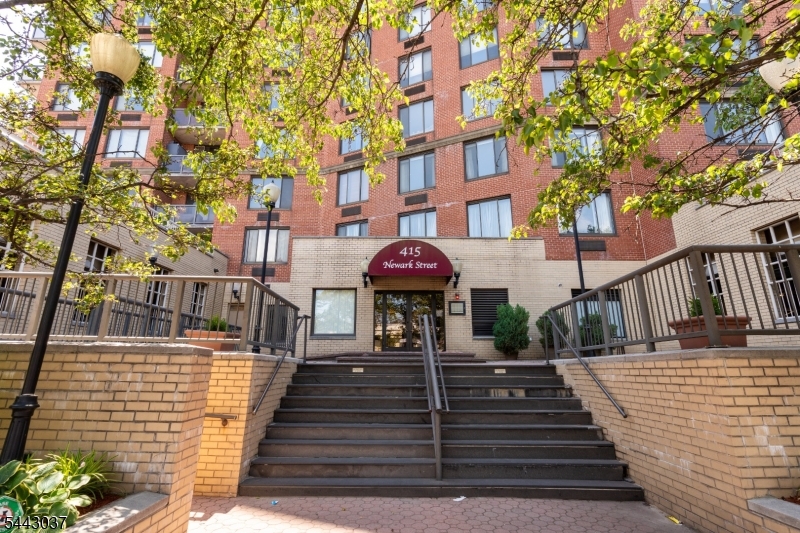 Welcome home to this beautiful and spacious 2 bedroom, 2bath corner unit in downtown Hoboken's highly sought out location. Flooded with natural light from expansive wrap-around windows, this thoughtfully designed home features an open-concept living and dining layout perfect for both daily living and effortless entertaining.Step outside onto 145 sq. Ft. private terrace to enjoy incredible skyline vistas, spectacular July 4th fireworks, and the occasional magic of a full 180 degree rainbow stretching across the sky! Gourmet kitchen that is beautifully updated with sleek white shaker cabinetry, a modern touch screen microwave, stainless steel appliances, premium granite countertops, and an inviting breakfast bar. Custom Hunter Douglas window treatments, new Wi-Fi-enabled heating and cooling units in the bedrooms, and beautiful hardwood flooring throughout. Flexible 2nd bedroom, generously sized and ideal for a dedicated home office, or guest space. Unbeatable commutable location & convenience to the NJ Transit bus direct to NYC's Port Authority Bus Terminal, downtown Hoboken's vibrant dining, cafes, and shopping scene and Hoboken PATH, NJ Transit trains, and Light Rail.