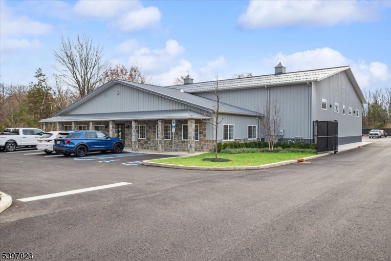UNBELIEVABLE: BRAND NEW 9,875 SF INDUSTRIAL BUILDING LOCATED ON 9.44 ACRE LOT, FOUR 16' OVERHEAD DOORS, 18 ' CEILING CLEARANCE, 800 AMP- THREE PHASE ELECTRIC, RADIANT HEATED FLOORS THROUGHOUT SHOP AND OFFICES, 1,875 SF OFFICE, FIVE PRIVATE OFFICES, CONFERENCE ROOM, FULL KITCHEN, ADA COMPLIANT BATH, FULLY FURNISHED OFFICES WITH  FURNITURE AND COMPUTERS, EMTEK HARDWARE, APPROXIMATE 1 ACRE OUTDOOR STORAGE, TOTALLY FENCED, IDEAL USE FOR CONTRACTOR/LIGHT MANUFACTURING USER
