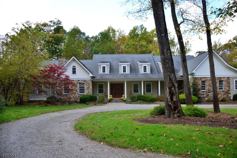 This custom home is an architectural masterpiece, the grand foyer sets a tone of class and sophistication. The light and bright living room boasts gleaming hardwood floors & fireplace, family room with cathedral ceilings & a floor to ceiling fireplace which opens to a gourmet kitchen equipped with full size double ovens,extra-large center island, endless cabinets & full butler?s pantry. First floor master suite with walk in closet and spa like bathroom. First floor stately office or library look out to the park like property with majestic views. These are just a few of the finer points of this home centrally located close to major roadways, shopping, lakes, hiking etc