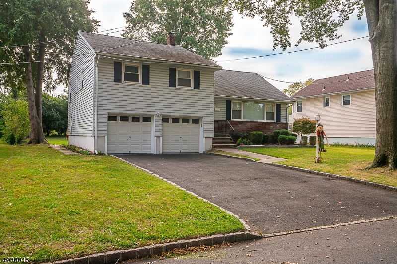 Welcome home to this fully renovated and stunning split level nested on an oversized lot located in the desirable town of Cranford. This three bedroom, two bath home features newly installed wide planked hard wood floors, open concept living and dining rooms leading you right into the elegant kitchen. The gourmet kitchen features white quartz counter tops, subway backsplash tiles and new stainless steel appliances. Also enjoy a separate playroom/bonus living space and a fully finished basement. Located near Cranford's downtown! House is not in a flood zone!*