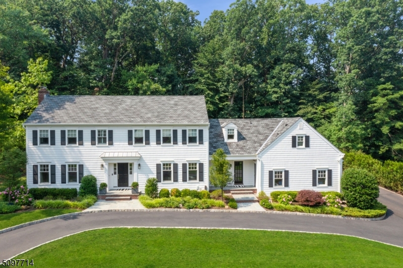 FOR COMP PURPOSES ONLY *** Welcome to 26 Merrywood Lane, a spectacular Center Hall Colonial nestled on a quiet street in coveted Old Short Hills. This home sits on 0.46 acres and offers comfortable, luxurious living with an easy-flowing floor plan, high-end finishes, designer lighting, and an unbeatable location near top-rated Millburn schools and NYC trains.* Stately foyer leads to living room w/ fireplace with marble surround and French doors that lead to the Bluestone patio. Elegant dining room has a large bay window. Stunning gourmet kitchen boasts white cabinetry, quartz counters, SS appliances (Subzero/Wolf), lg center island with bar seating and mudroom. Breakfast room adjs family room w/ multiple windows and access to 2-car garage. Bonus room could be 1st flr office or 1st flr bedroom. Luxurious primary suite with large walk-in closet, spa-like bath w/ soaking tub & glass shower. 5th BR & full bath is private suite off family room. The finished lower level has it all: lrg rec rm, exercise rm, possible nanny space, full bath & laundry. Outside = WOW! Amazing entertaining patio with outdoor TV, custom-built stone wall and additional upper level Bluestone patio, lush and expansive yard means relaxation and privacy! Close to Short Hills train & Hartshorn Elementary. YOUR DREAM HOME in an unbelievable Short Hills location!