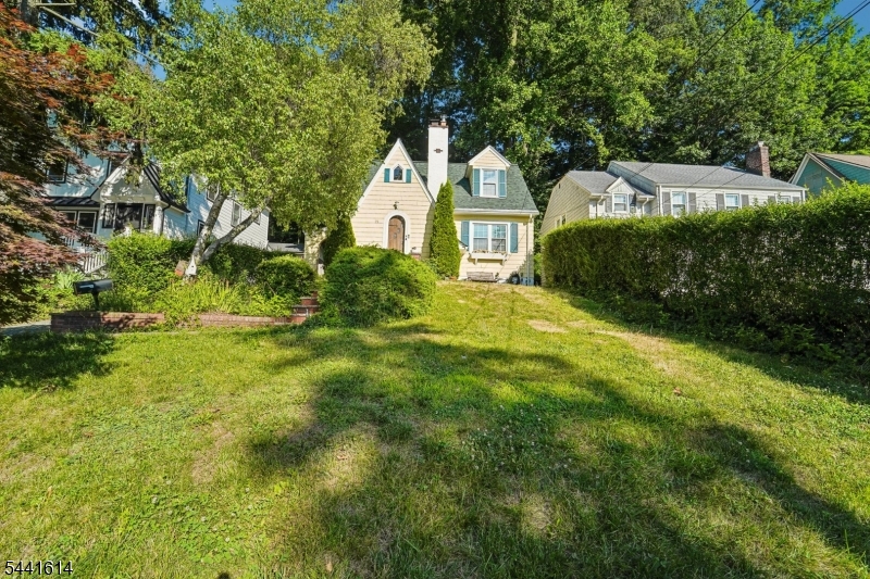 Welcome home to this storybook English Colonial Cottage nestled in the sought-after Gregory neighborhood of West Orange! Perfectly positioned just moments from top-rated schools, beautiful parks, NYC transportation, and the FREE jitney to the South Orange NJ Transit station, this home offers the ideal blend of timeless charm and everyday convenience.Inside, classic character meets thoughtful updates. A beautifully remodeled kitchen (2022) serves as the heart of the home, while brand new auto-closing solar skylights and a brand-new roof (June 2026) bring peace of mind and abundant natural light. Additional improvements include whole-house insulation, upgraded electrical service, a new water heater, retaining wall (2019), and a new shed platform (2025).Whether you're enjoying the warmth and charm of this classic Colonial Cottage or taking advantage of everything the vibrant Gregory community has to offer, this is a home that truly checks all the boxes. Move in, unpack, and start making memories!