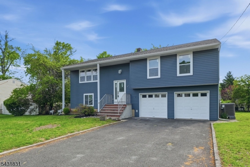 Welcome to this newly completed, fully renovated bi-level home located on a quiet street in the heart of Piscataway. Situated on an oversized 100x100 lot, this move-in ready property offers 5 bedrooms, 3 full bathrooms, and 1,916 sq ft of beautifully updated living space designed for modern living.Every detail has been completely redone with quality finishes throughout. The home features a brand new GAF Timberline HDZ architectural roof, new siding with exterior insulation, white gutters, fresh landscaping, and excellent curb appeal. The exterior is further enhanced with brand new Silver Line windows finished with premium Azek PVC trim for a clean, low-maintenance look.Inside, enjoy a bright open-concept layout with new flooring throughout, recessed lighting, and abundant natural light. The stunning new kitchen is the centerpiece of the home, featuring a large center island, quartz countertops, custom cabinetry, and brand new stainless steel appliances.All bathrooms have been fully updated, and the home also includes brand new plumbing, electrical, HVAC, forced air heating, and central air conditioning for complete peace of mind.Additional highlights include a 2-car garage, oversized 4-car driveway, and convenient access to Route 22 and Route 287, making commuting easy while still enjoying a quiet residential setting.A rare opportunity to own a completely turnkey home with modern upgrades, spacious living, and a prime Piscataway location.