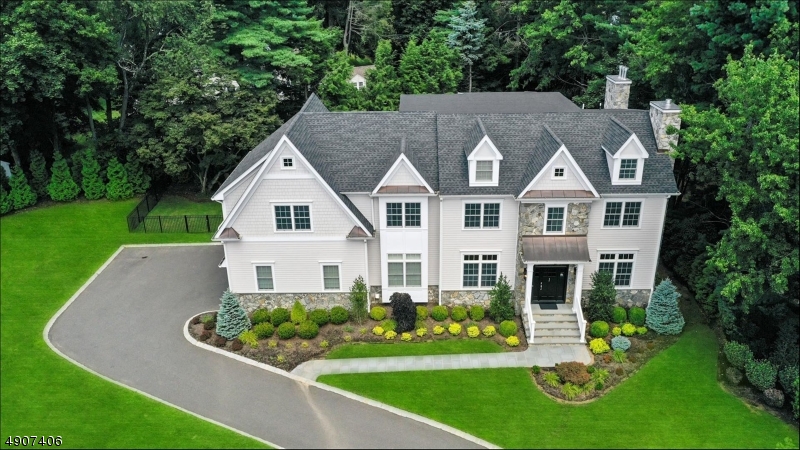 This 2016 custom home has more upgrades than found in most new builds. This is a must see home ! There is a gracious entry into the first floor with high ceilings throughout, that is flanked by a formal dining and liv rm w/fireplace. Pristine hardwood floors lead to the open family room ( w/ fireplace) & east in custom kitchen with center island. Perfect for entertaining a large butlers pantry. Step out to a lovely outdoor entertaining patio complete w/ fireplace. On the second floor there is a master bedroom with fireplace, dressing area ( complete with built in storage) large WIC and a master bathroom complete with soaking tub.  The third floor is finished beautifully w/ added storage. The basement is also finished w a fireplace & wine tasting room. A stunning home !! LIKE NEW!