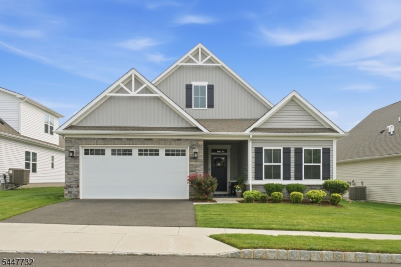 This two-bedroom, two-bath custom home features an open-concept floor plan suited for both everyday living and entertaining. The kitchen includes quartz countertops and upgraded cabinet and door hardware, opening onto bright living areas. The primary suite includes a walk-in closet, and a flexible bonus room offers additional space as a home office, formal dining room, or guest bedroom. Located in the Village at Hawk Pointe, the home is part of a community anchored by the Hawk Pointe Golf Club, with optional golf and social memberships available at a discounted rate. Shopping, restaurants, and medical offices are all nearby, with easy access to Routes 31, 78, and 80.