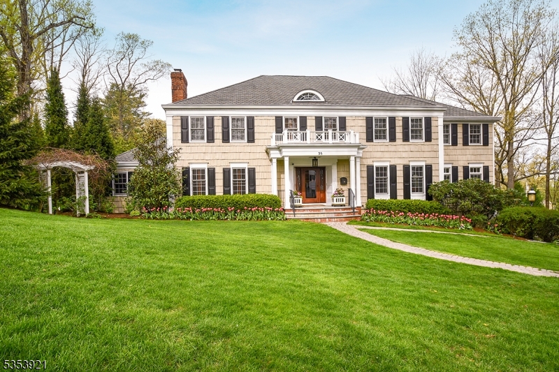 Luxury, lifestyle and location!  This six-bedroom Woodland Park Colonial is a showcase Summit residence -- superlative through and through. Highlights include first floor guest suite, expansive chef's kitchen with spacious eating and work areas, and multiple living and entertaining areas.  Five bedrooms on the second floor including the romantic primary suite with gas FP, double dressing rooms and luxurious bath with two custom vanities, jetted tub & oversized multi-head shower. 2nd floor laundry. Expansive lower level with rec room, media room, wine cellar and 2nd powder room, with easy access to oversized heated garage with plentiful built-in storage. Stunning outdoor entertainment area with bluestone covered patio, hot tub, gas fire pit, outdoor kitchen and bar with retractable awning, and separate deck off kitchen and DR.  Gorgeous landscaping creates exceptional privacy and multiple areas for play and relaxation. No detail overlooked in this stunning home!