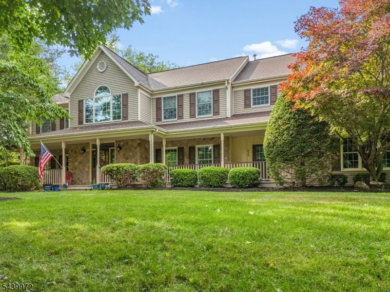 Welcome to this masterfully curated impressive colonial striking a perfect balance between architectural elegance & modern function. This immaculate home showcases extensive custom millwork, pristine crown moldings & gleaming HW floors flowing thru both expansive levels. The sweeping main-floor layout incl. a grand formal DR & elegant LR, & french doors to a private playroom/office. The heart of the home is an expansive eat-in kitchen, w/ classic white cabinets, center island, newer appliances, separate walk-in pantry, & butler's pantry for effortless entertaining. Filled w/ natural light, the ample breakfast area leads to a sprawling deck, overlooking a private, park yard complete w/ mature trees & brand-new fencing. Adjacent family room is a warm gathering space w/ charming fireplace. The intelligently designed 2nd floor is a brilliant multi-zone haven. Ascend the formal front staircase or the highly coveted informal staircase to find a massive loft/2nd family room. The bedroom accommodations incl. a lavish primary suite w/ private sitting rm/office, a dedicated Princess Suite/private bath; & 2 further BRs connected by a classic Jack-n-Jill bath configuration. Big-ticket mechanical updates offer ultimate peace of mind, including a newer roof, newer AC. comfort & convenience are key w/ 2-zone heating/cooling, 3-car garage, clean full basement w/ walk up steps directly into the garage. A truly exceptional offering on Hillsborough's most desirable low traffic circle.