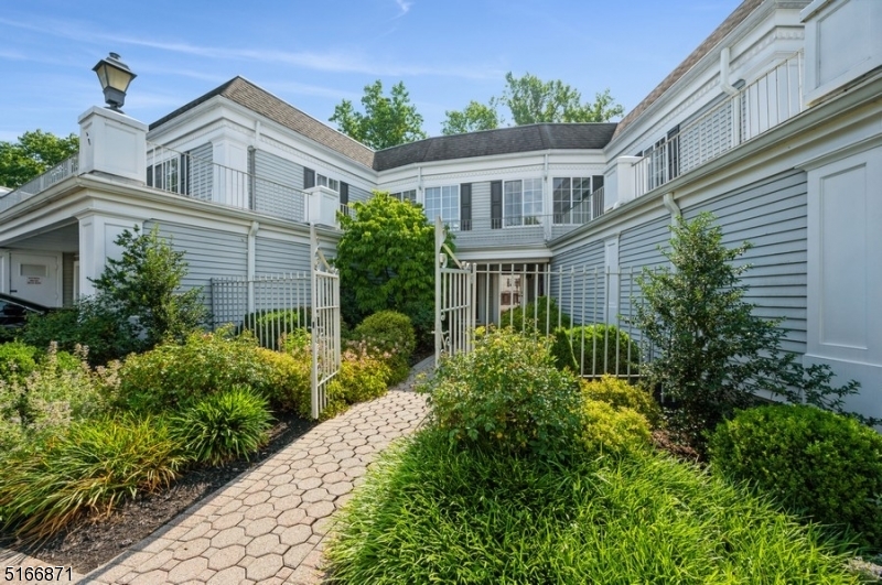 Modern townhouse offering style, comfort, and convenience! Live the lifestyle you've dreamed about in this spacious, two-story townhome w/ 3BD 2 1/2 BTH & an attached 1-car garage. Tucked into the Sutton Woods community with a pool and tennis courts, this unit offers all the benefits of suburban living without the yard work or maintenance. Highlights include Brazilian cherry hardwood floors in the living and dining rooms, two balconies w/views of the Passaic River & woods, custom millwork throughout, and three large walk-in closets. Beyond the large, tiled foyer, the open interior flows from the large living room and formal dining room to the eat-in kitchen. The kitchen boasts warm cherry cabinets, stainless steel appliances, beautiful granite counters and backsplash, and a large walk-in pantry. From the dining room, step outside to the private balcony with treetop views, perfect for morning coffee and evening wine. A walk-in pantry, powder rm, and access to the attached garage complete the first floor. The second floor includes the primary bedroom suite w/2 WIC, a private balcony, and a sumptuous en suite bathroom with a dual sink vanity, soaking tub, and glass shower. There are 2 addt'l bedrooms, one w/a WIC, plus a full hallway bathroom and convenient laundry room. Situated in a quiet, beautifully landscaped community bordering parkland, this townhome is just minutes to the Chatham & Summit train stations, stores, eateries, parks, and RT 78 & 24.