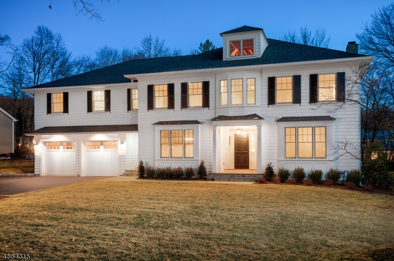 Stunning WP Lloyd house in sought after Wickham Woods.Gracious double staircase,7 bed,6.1 bath colonial is a must see nothing left to do but bring your toothbrush. Every detail has been accounted for. 1st flr w/elegant din rm & liv rm, library, & open kitch/family room. Kitchen w/the best of everything! Custom soft close cabinets, Wolf range, SubZero fridge, massive center island overlooking the breakfast area and family room w/ wood burning fireplace! Butlers pantry w/wine fridge. 1st floor bedroom suite off mud room. 2nd flr w/5 generous sized brs including the stunning master suite w/heated marble floor bath, soaking tub, multi head shower and custom built closets. Walk up 3rd flr could be finished. Massive basement w/br suite, rec room & gym. One of the flattest lots around, ready for a pool or jungle gym!