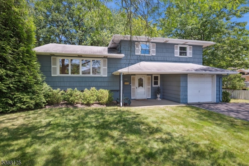 Welcome to 2291 Old Farm Road, located on one of Scotch Plains' most desirable streets. This beautifully updated split-level home offers the perfect blend of suburban tranquility and urban convenience. Just minutes to NYC bus service and Route 22, and close to downtown Scotch Plains, you'll enjoy easy access to shopping, dining, entertainment, and everyday amenities. The ground level welcomes you with a spacious foyer, a convenient powder room, and a large family room that opens to the patio and private backyard ideal for both relaxing and entertaining. This level also provides interior access to the attached one-car garage for added convenience. Step up to the main level where you'll find an open concept living space filled with natural light. The freshly painted interiors and gleaming refinished hardwood floors enhance the bright living room, dining area, and kitchen, creating an ideal setting for everyday living and hosting guests. Upstairs features a spacious primary bedroom with a private en-suite bath, along with two additional bedrooms served by a full hall bathroom. The lower level includes a dedicated laundry area and ample space for storage. Nestled in a peaceful, tree-lined neighborhood, this home is part of a highly rated school district and offers exceptional quality of life. With its spacious layout, thoughtful upgrades, and unbeatable location, this home is the perfect place to settle in and enjoy all that Scotch Plains has to offer