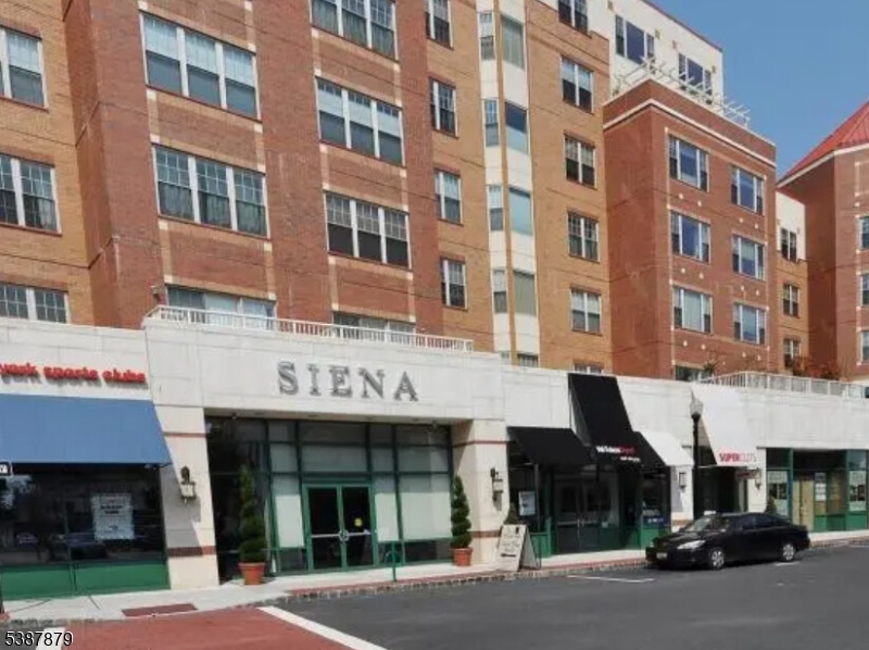 Enjoy the benefits of luxury living in this modern concierge building in downtown Montclair convenient to top rated restaurants, cafes, shopping, performing and fine arts, gyms and NYC transportation. Plenty of room for your belongings in this large primary bedroom with a walk-in closet, additional closet, ensuite bath with shower, double vanity and tub. The kitchen has beautiful wood cabinets, breakfast bar, granite counters and stainless steel appliances. It is open to the living room/dining area. Enjoy the convenience of in unit laundry. The powder room completes this apartment. Enjoy access to building's roof top deck with lounge and dining seatings perfect for relaxing after a long day and entertaining. Additional feature is the underground garage with assigned space. Maintenance includes concierge, common maintenance, water and sewer. Only utility owner pays is electric which includes heat, hot water, and air conditioning.