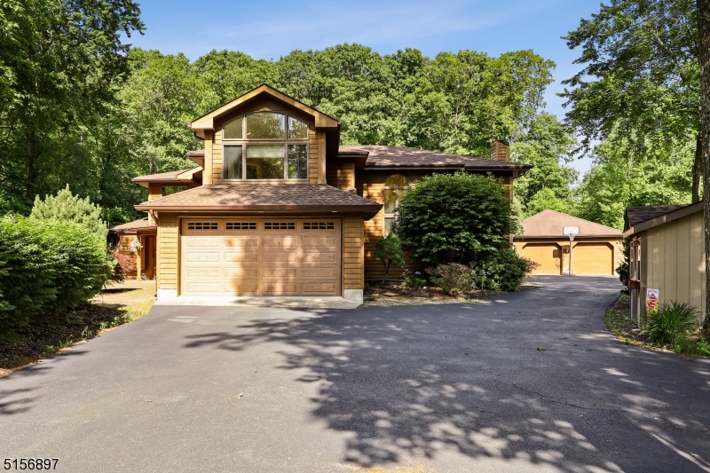 A beautiful oasis in Jefferson Township.  Check out this custom home with 4 generously sized bedrooms, 3 baths, and plenty of living space to spread out.  The granite eat-in kitchen with island is adorned with its own gas fireplace and 3 season room with separate heat.  This is the house that will grow with you.   A stunning backyard with heated pool, lovely landscaping, and extra space to roam.  Oversized two-car detached garage for all your toys.  Privacy, seclusion, and natural beauty at your fingertips.