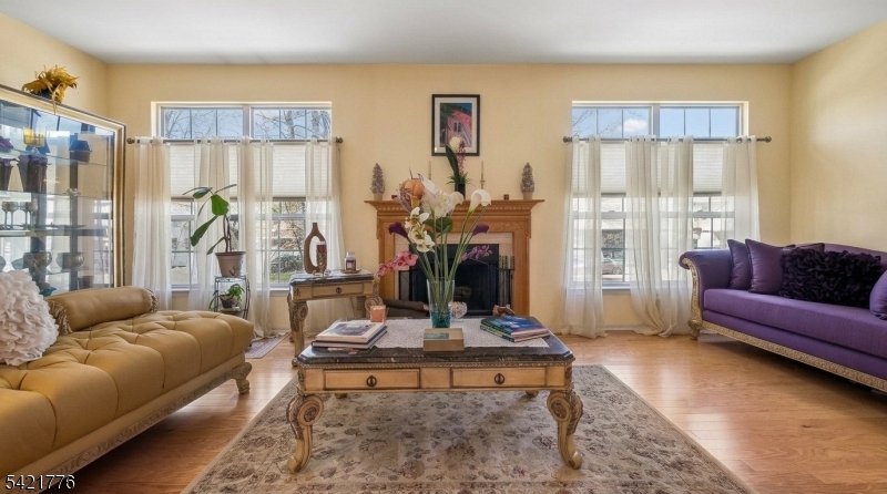 Don't have a car yet, then this home is a COMMUTER'S DREAM.  Ideally located within 10 MINUTES' WALKING DISTANCE to the NJT TRAIN with DIRECT SERVICE to MIDTOWN MANHATTAN in approximately 30 minutes. The unit qualifies for DOWN PAYMENT ASSISTANCE and low interest rate.  Don't miss this opportunity to own this beautifully maintained townhouse offering the perfect blend of space, comfort, and unbeatable convenience in the heart of Rahway with low monthly maintenance. . Featuring 3 spacious bedrooms and 3.5 baths, this home offers a versatile layout designed for modern living. The main level showcases a bright living room and dining area with hardwood floors, a cozy gas fireplace that is perfect for entertaining or relaxing evenings. The eat-in kitchen includes stainless steel appliances, a pantry closet, and an easy flow for everyday functionality. An updated powder room completes the first level. On the second floor, you'll find three bedrooms, including a primary suite with a full bath, WALK-IN CLOSET, a hallway bath, and the added convenience of a second-floor LAUNDRY ideal for today's lifestyle.  The WALKOUT BASEMENT provides additional living space and serves perfectly as a FAMILY ROOM, complete with a full bath and garage access. Sliders lead to a private backyard patio, offering a great space for outdoor enjoyment. Located near RAHWAY'S VIBRANT DOWNTOWN, you'll enjoy proximity to top-rated restaurants, shopping, parks, recreation, and houses of worship.
