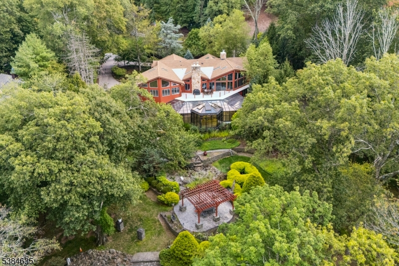 Nestled in one of the desired and affluent area this 6BR 7.5Bth Lakefront split level home has a lot to offer. Sitting on a 1.4acre lot this home has a large entry foyer, a proportionally size receiving room, a huge dining & living room area w/ direct access to a spacious terrace overlooking the backyard and the lake, an oversized eat-in kitchen with adjoining butler room, 4 fireplaces and 2 staff quarters. In the 1st level, there are 2 proportionally sized bedroom sharing a full size hallway bathroom,  a large bedroom with ensuite bathroom,  and an oversized main bedroom and bathroom (both with a tub and standing shower). The second level which is above ground has 2 appropriately sized bedroom both with ensuite bathroom. The second level has a huge recreational, visual and audio room which leads to a colossal conservatory/solarium with a wet bar perfect for entertainment and gathering for any occasion(s).The backyard has a pergola and barbeque area if you so desire to go have an outdoor cookout. The backyard has a lot of trees that provides a great shade on hot sunny days. Plenty of area to do your landscaping vision as well. This home has a 2-car garage and ample fenced area for 4 more vehicles. In addition, the whole roof has just been replaced. Whether it will your Primary or an Investment Property,  this is truly a home you don't want to miss out. Call now to book your appointment to see it in person.
