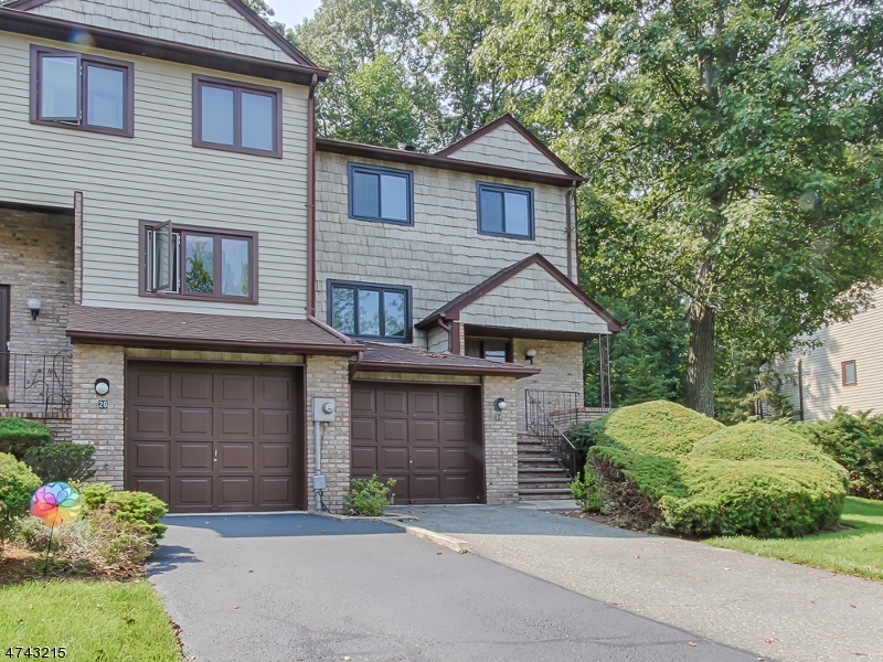 Brand New Kitchen, granite counters, All new windows,  new carpet upstairs, hardwood floors on first floor, Fireplace in Living Room, Great Room on first level. Franklin end unit. Large deck off sliding glass doors from kitchen backing woods! Full basement. Nice side street with great yard.