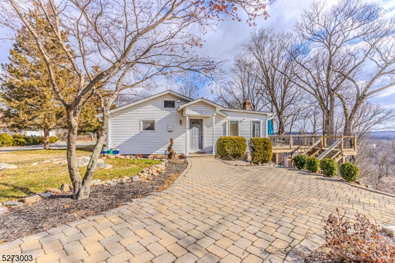 Impeccable Ranch Rental w/stunning Lake & NYC Skyline Views surrounded by Jonathan's Woods which includes 635 protected green acres & hiking trails. Truly an oasis of peace & privacy located in the Cedar Lake section of Denville - truly unique & captivating property. OVER 1 acre on quiet, dead end street. ONE FLOOR LIVING. Features include updated galley style kitchen with stainless steel appliances. NEW dishwasher & refrigerator. Separate dining area. Bright living room on the back of home. An abundance of windows throughout provide a beautiful ambience, tons of natural light & stunning views. Charming stone fireplace. 2 generous sized bedrooms. 1 Full and half bath. Clean and nicely updated baths.. The back deck is a priceless addition to this home, offers easy indoor/outdoor access & a quiet lifestyle. Perfect for entertaining or relaxation! TONS of Storage in unfinished bsmt. Off street parking. Enjoy the lovely and desirable Cedar Lake community- Clubhouse, beaches and boating! Tons of activities for all ages. Minutes to DWTN Denville -a vibrant DWTN with shopping, restaurants & events. Experience tranquility & privacy right in your own backyard w/all the conveniences of NYC mass transit & easy access to major hwys. Tons of upgrades include new window units, washer/dryer, water softener ('21), well pump ('22), water heater, neutralizer system, water softener ('23) and BRAND NEW windows will be installed in LR & Kitchen March 2024.